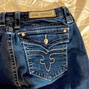 Rock Revival Blue Jeans with Distinctive Stitching and Faded soft.